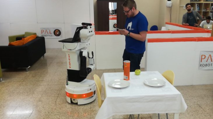 TIAGo robot at the European Robotics League with a researcher
