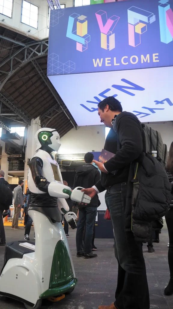 The humanoid robot REEM shakes hands at the World Mobile Congress (WMC)