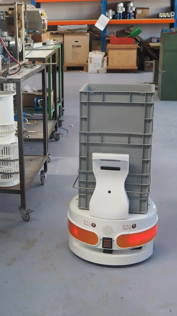 The autonomous mobile robot (AMR) TIAGo Base with a box